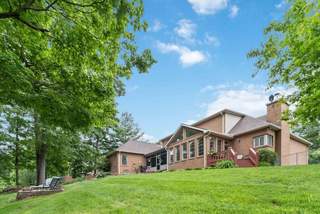 512 Water Cliff Dr, Somerset, KY 42503 - rear view of house with brick siding, a chimney, and a wooden deck