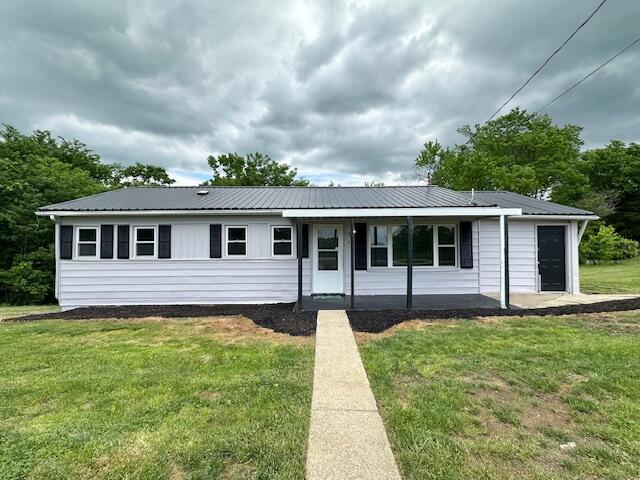 10650 Georgetown Rd, Owenton, KY 40359 - ranch-style house featuring a front lawn, metal roof, and a porch