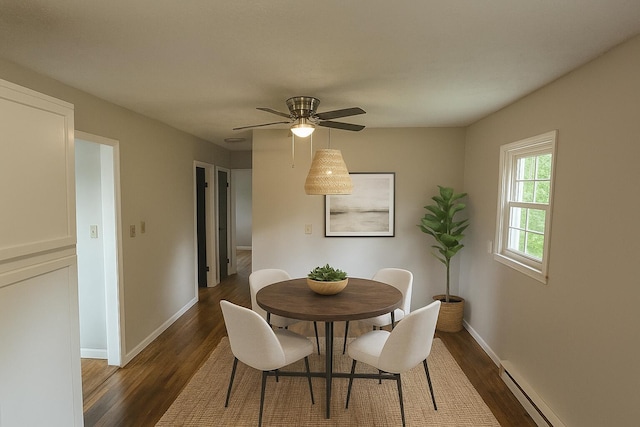 10650 Georgetown Rd, Owenton, KY 40359 - dining area with dark wood-type flooring, a baseboard radiator, and a ceiling fan