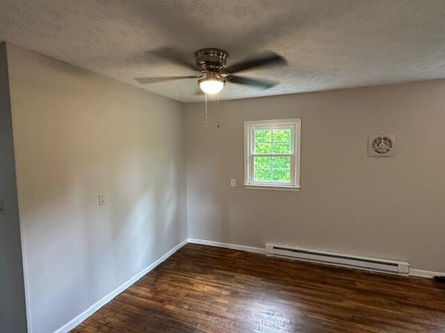 10650 Georgetown Rd, Owenton, KY 40359 - spare room with a baseboard radiator, ceiling fan, dark wood-style flooring, and a textured ceiling