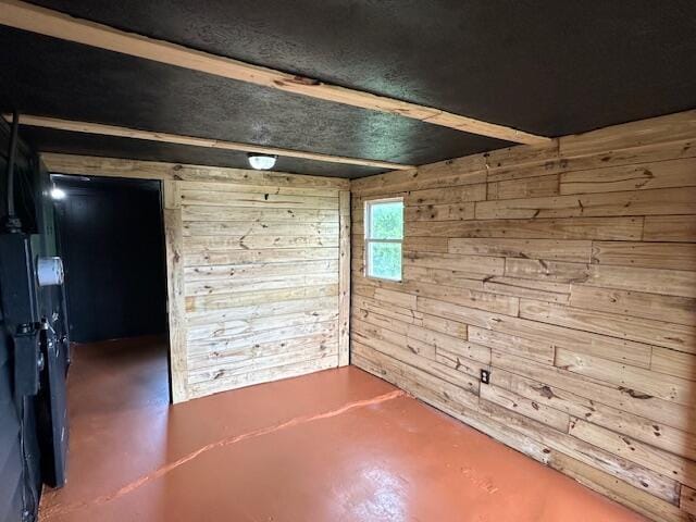 10650 Georgetown Rd, Owenton, KY 40359 - spare room featuring wooden walls and finished concrete floors