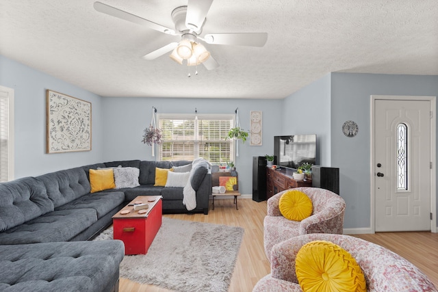 117 Autumn Dr, Russell Springs, KY 42642 - living area with light wood-style floors, a textured ceiling, ceiling fan, and baseboards