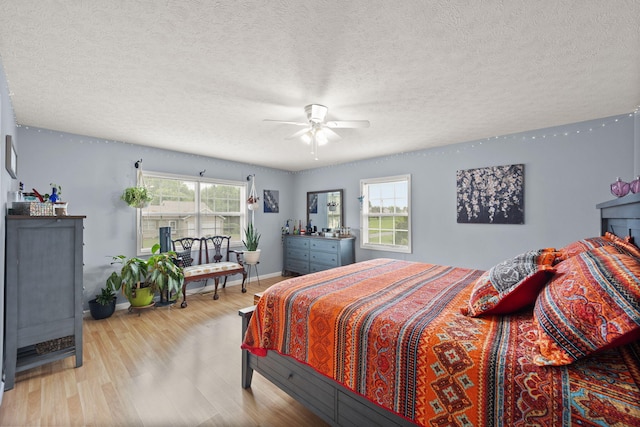 117 Autumn Dr, Russell Springs, KY 42642 - bedroom with wood finished floors, baseboards, a textured ceiling, and ceiling fan