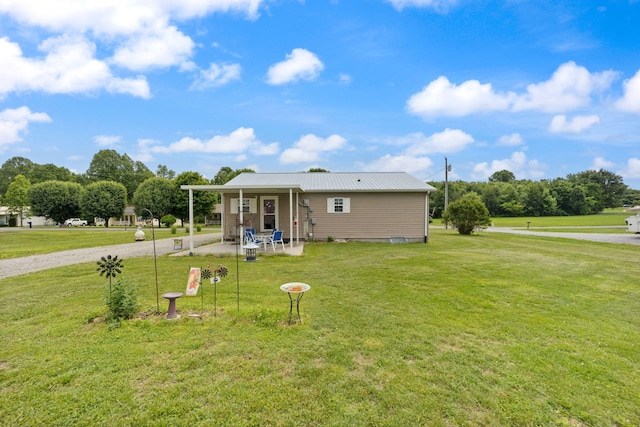 117 Autumn Dr, Russell Springs, KY 42642 - rear view of house with a lawn, a patio, and metal roof