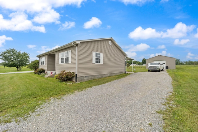 117 Autumn Dr, Russell Springs, KY 42642 - view of property exterior featuring driveway, a garage, a yard, crawl space, and an outdoor structure