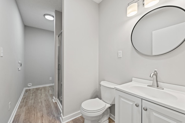110 Hazel Ave, Lexington, KY 40502 - full bath featuring wood finished floors, vanity, toilet, and an enclosed shower