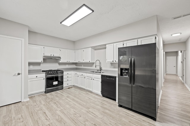 110 Hazel Ave, Lexington, KY 40502 - kitchen featuring range with gas stovetop, dishwasher, stainless steel refrigerator with ice dispenser, under cabinet range hood, and a sink