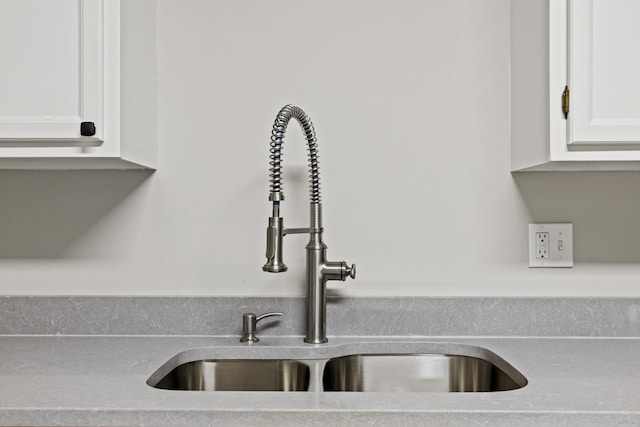 110 Hazel Ave, Lexington, KY 40502 - kitchen view of a sink, white cabinets, and light countertops