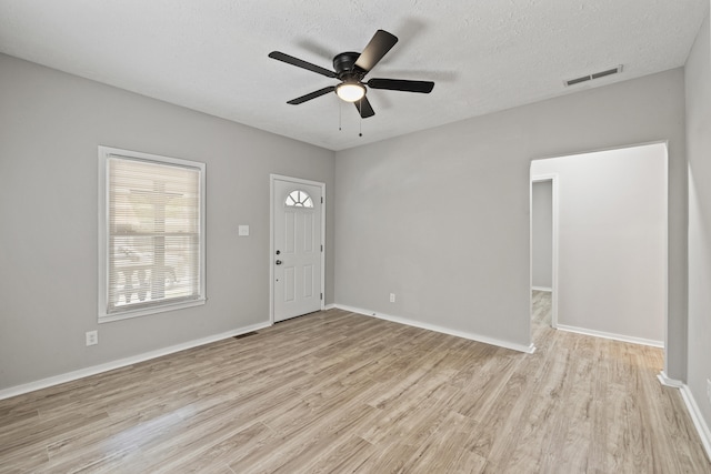 110 Hazel Ave, Lexington, KY 40502 - entrance foyer with light wood-style flooring, a ceiling fan, a textured ceiling, and baseboards