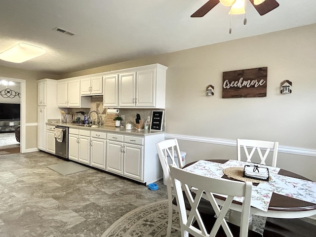 317 Hidden Loop Dr, Somerset, KY 42503 - kitchen featuring dishwasher, a ceiling fan, a sink, backsplash, and white cabinetry