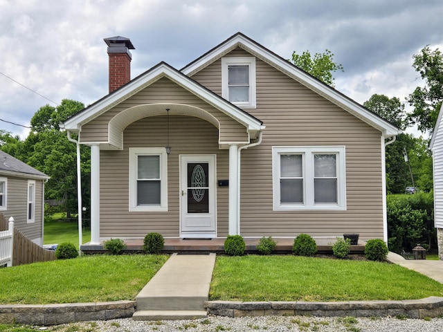 42 Wheeler Ave, Winchester, KY 40391 - bungalow-style house with a front yard, a chimney, and a porch
