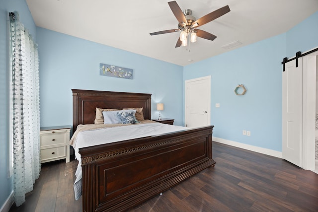 42 Cambron Ln, Raywick, KY 40060 - bedroom with a barn door, dark wood-style floors, and ceiling fan