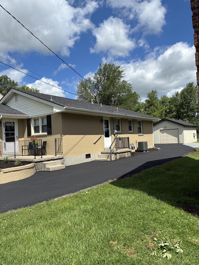 212 Baughman Ave, Danville, KY 40422 - ranch-style home featuring a garage, an outdoor structure, a front yard, and central AC