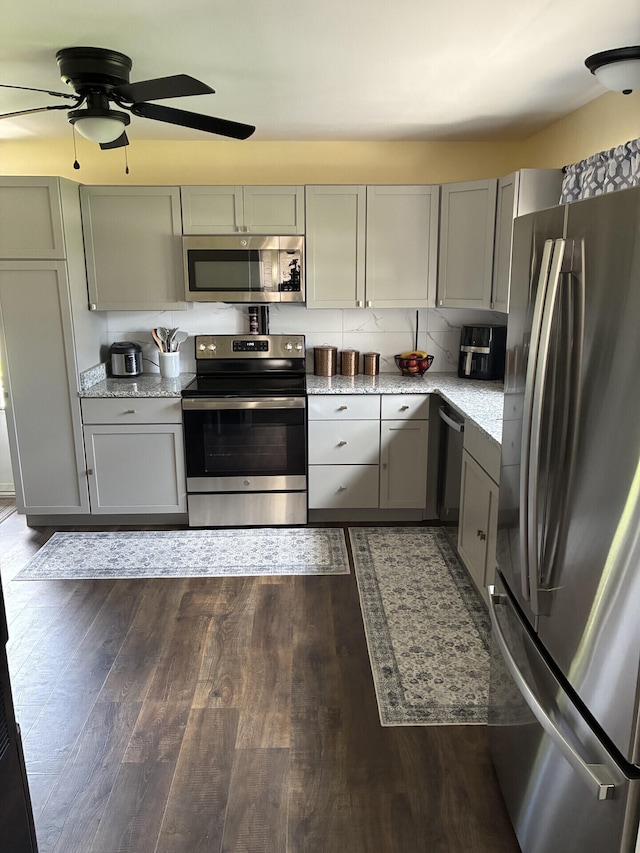 212 Baughman Ave, Danville, KY 40422 - kitchen with stainless steel appliances, gray cabinets, ceiling fan, and dark wood-style flooring