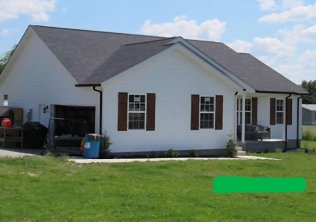 135 Watkins Branch Rd, East Bernstadt, KY 40729 - rear view of property with a lawn