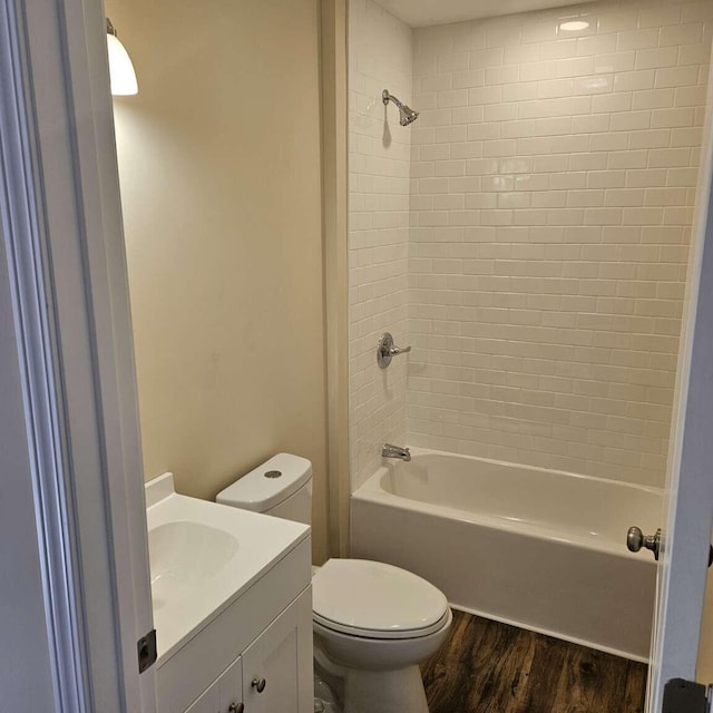135 Watkins Branch Rd, East Bernstadt, KY 40729 - full bathroom with wood finished floors, toilet, tub / shower combination, and vanity