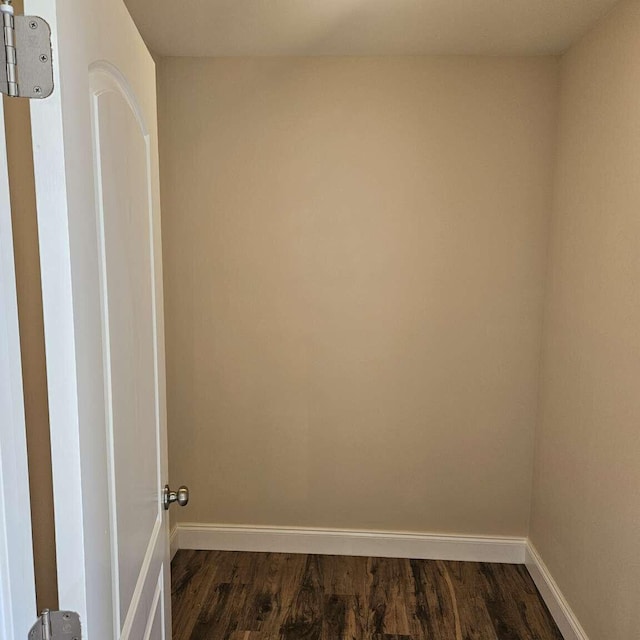 135 Watkins Branch Rd, East Bernstadt, KY 40729 - unfurnished room with baseboards and dark wood-style flooring