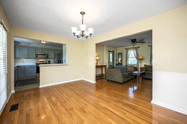113 Medinah Ct, Frankfort, KY 40601 - living room featuring light wood-style flooring, a chandelier, baseboards, and ceiling fan