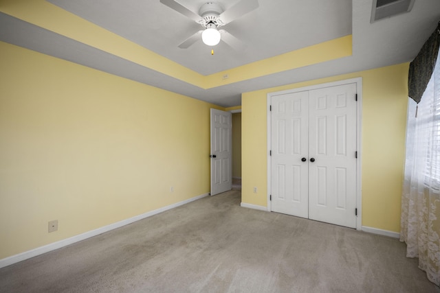 113 Medinah Ct, Frankfort, KY 40601 - unfurnished bedroom featuring carpet flooring, baseboards, a tray ceiling, and a closet