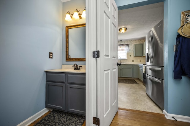 113 Medinah Ct, Frankfort, KY 40601 - bathroom featuring vanity, baseboards, wood finished floors, and a textured ceiling