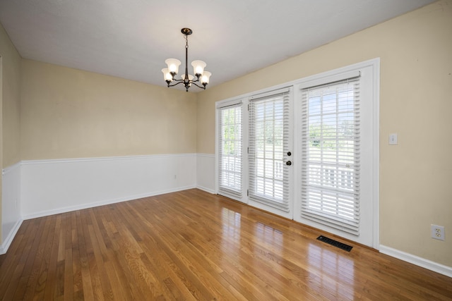 113 Medinah Ct, Frankfort, KY 40601 - spare room featuring hardwood / wood-style flooring, a chandelier, and baseboards