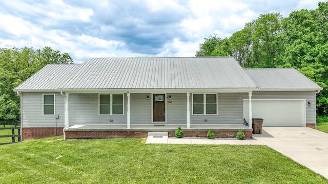 2296 Boonesborough Rd, Richmond, KY 40475 - ranch-style home with covered porch, a garage, concrete driveway, and metal roof