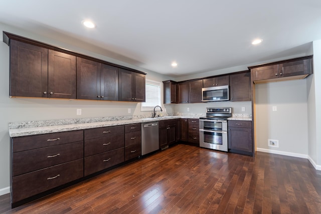 2296 Boonesborough Rd, Richmond, KY 40475 - kitchen with stainless steel appliances, dark brown cabinets, dark wood-style floors, baseboards, and recessed lighting