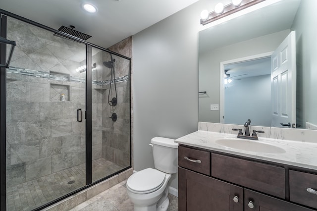 2296 Boonesborough Rd, Richmond, KY 40475 - bathroom featuring toilet, vanity, a stall shower, ceiling fan, and baseboards