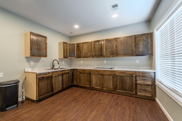 2296 Boonesborough Rd, Richmond, KY 40475 - kitchen featuring a sink, dark wood-type flooring, light countertops, and baseboards