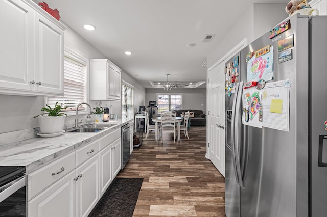 1130 Three Corners Dr, Lawrenceburg, KY 40342 - kitchen featuring stainless steel appliances, a sink, white cabinets, recessed lighting, and dark wood finished floors