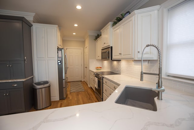 360 Persimmon Way, Harrodsburg, KY 40330 - kitchen with stainless steel appliances, a sink, white cabinetry, recessed lighting, and tasteful backsplash