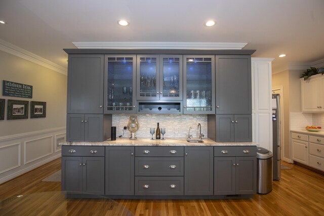 360 Persimmon Way, Harrodsburg, KY 40330 - indoor bar featuring ornamental molding, wood finished floors, freestanding refrigerator, backsplash, and recessed lighting