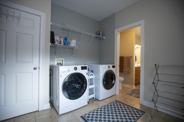 360 Persimmon Way, Harrodsburg, KY 40330 - laundry room featuring washer and clothes dryer, light tile patterned flooring, and baseboards