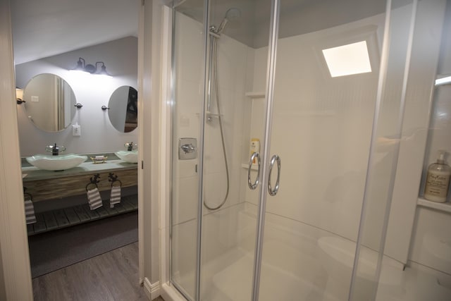 360 Persimmon Way, Harrodsburg, KY 40330 - full bathroom with wood finished floors, a shower stall, double vanity, and vaulted ceiling