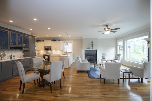 360 Persimmon Way, Harrodsburg, KY 40330 - dining room with crown molding, a fireplace, recessed lighting, a ceiling fan, and wood finished floors