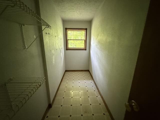 315 Della Winchester Rd, Nancy, KY 42544 - corridor with light floors, baseboards, and a textured ceiling