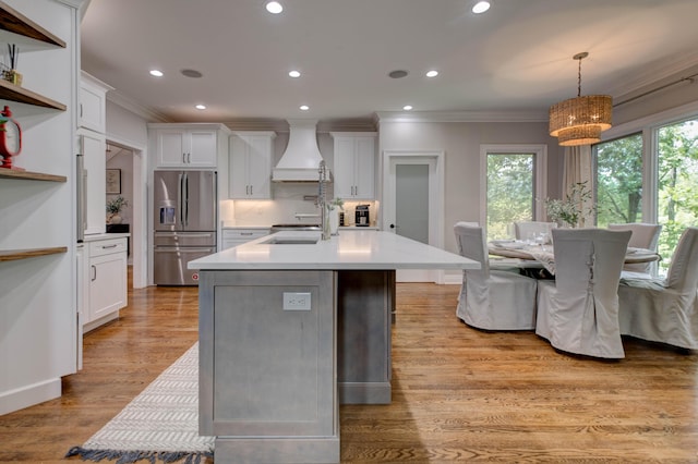 1304 Wakehurst Ct, Lexington, KY 40509 - kitchen featuring stainless steel fridge, custom range hood, ornamental molding, white cabinets, and light countertops