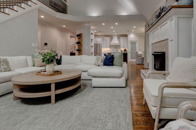 1304 Wakehurst Ct, Lexington, KY 40509 - living area with wood finished floors, a high end fireplace, stairway, ornamental molding, and recessed lighting