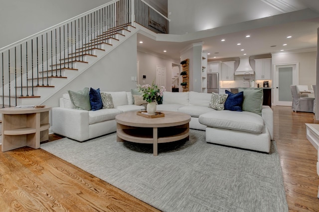 1304 Wakehurst Ct, Lexington, KY 40509 - living area featuring crown molding, light wood-style floors, recessed lighting, stairway, and a towering ceiling