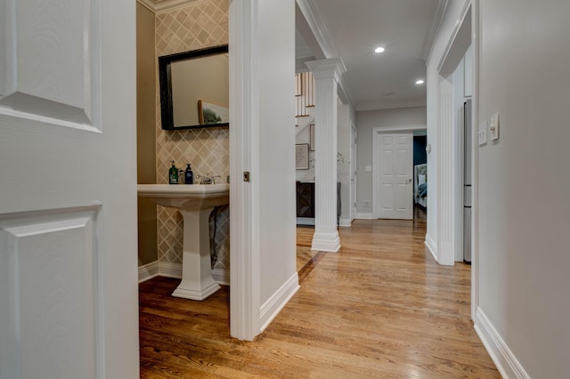 1304 Wakehurst Ct, Lexington, KY 40509 - hallway featuring ornate columns, crown molding, light wood-style flooring, recessed lighting, and baseboards