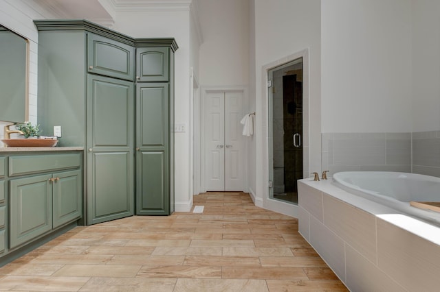 1304 Wakehurst Ct, Lexington, KY 40509 - bathroom with a bath, a stall shower, vanity, and wood finished floors