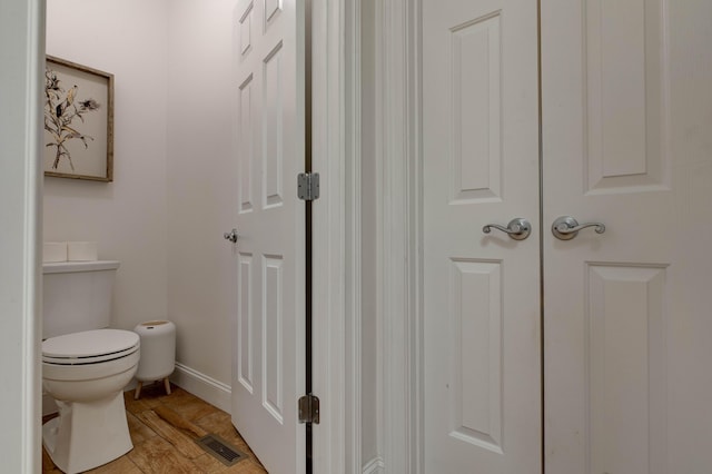 1304 Wakehurst Ct, Lexington, KY 40509 - bathroom with toilet, baseboards, and wood finished floors