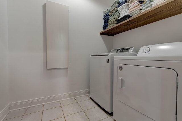 1304 Wakehurst Ct, Lexington, KY 40509 - washroom with washing machine and dryer, baseboards, and light tile patterned floors