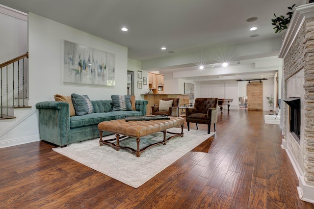 1304 Wakehurst Ct, Lexington, KY 40509 - living area featuring a barn door, dark wood-style floors, stairway, recessed lighting, and a fireplace
