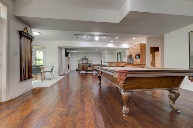 1304 Wakehurst Ct, Lexington, KY 40509 - recreation room with baseboards, dark wood-style flooring, and rail lighting