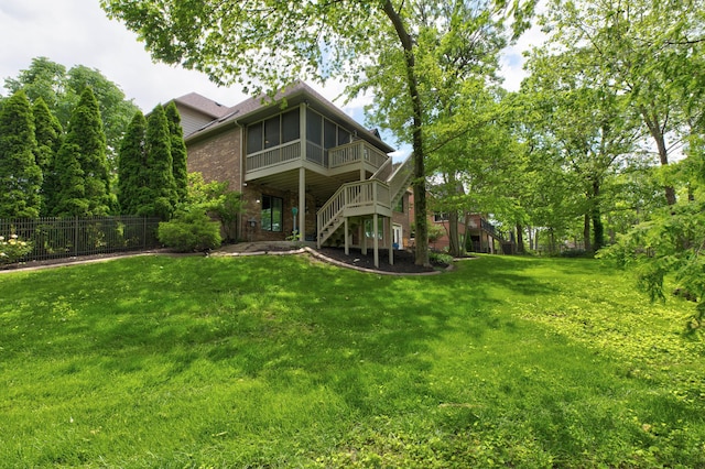 1304 Wakehurst Ct, Lexington, KY 40509 - rear view of house featuring stairway, a sunroom, brick siding, and a wooden deck