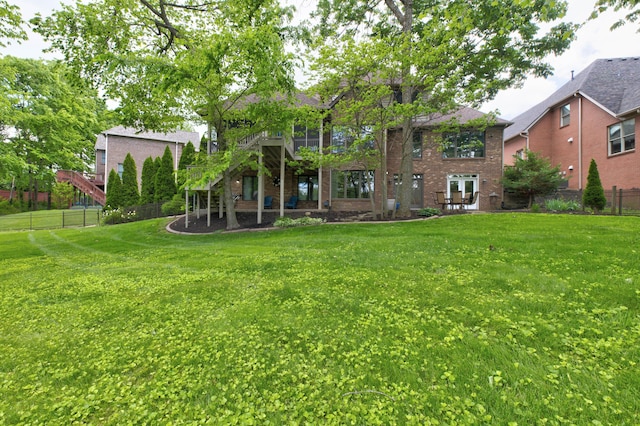 1304 Wakehurst Ct, Lexington, KY 40509 - back of property featuring brick siding, stairs, and a deck