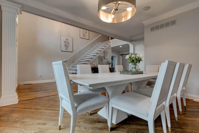 1304 Wakehurst Ct, Lexington, KY 40509 - dining space with decorative columns, ornamental molding, stairs, baseboards, and wood finished floors