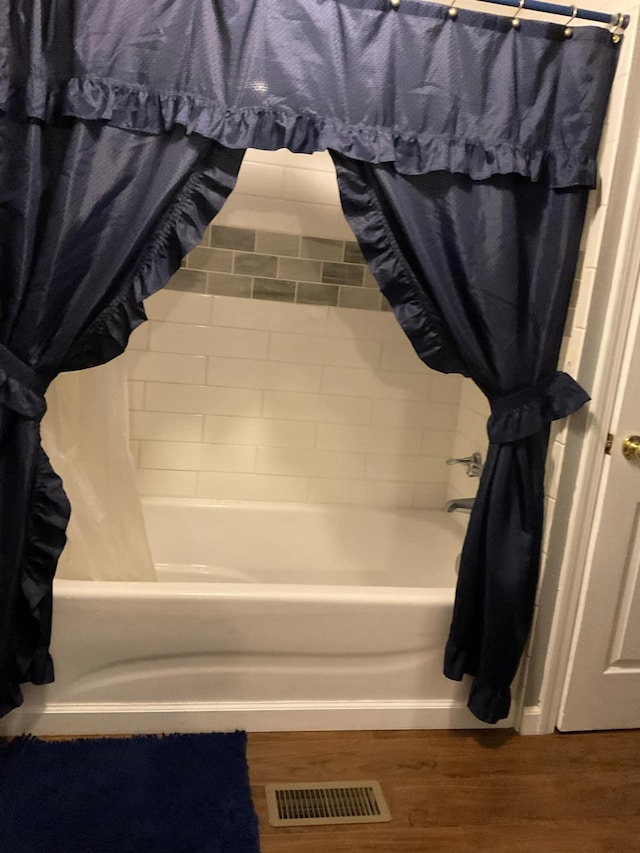 33 Banta Rd, Olive Hill, KY 41164 - full bath with wood finished floors and shower / tub combo with curtain