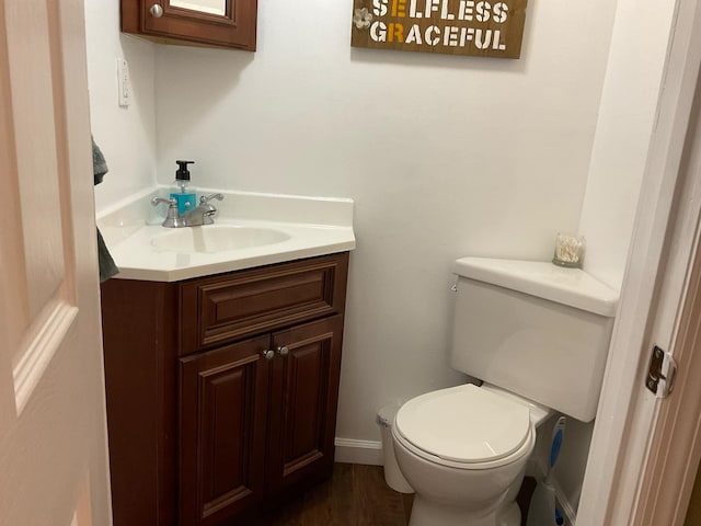 33 Banta Rd, Olive Hill, KY 41164 - bathroom featuring vanity, toilet, wood finished floors, and baseboards